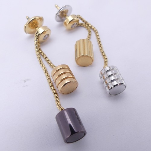 Boucheron; A pair of 18ct gold 'Quatre' pendant Earrings, each diamond set stud suspending two varying colour barrel shaped pendants, the signed reverses numbered E75280, 4cm long drops, total weight 9g.