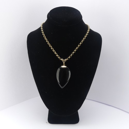 225 - A 9ct gold mounted Whitby Jet Pendant, the pear shaped stone suspended from a 9ct gold split bale, 4... 