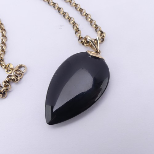 225 - A 9ct gold mounted Whitby Jet Pendant, the pear shaped stone suspended from a 9ct gold split bale, 4... 