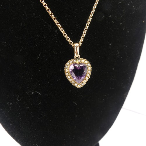 228 - A late Victorian amethyst and seed pearl Pendant, the heart shaped facetted amethyst within a surrou... 