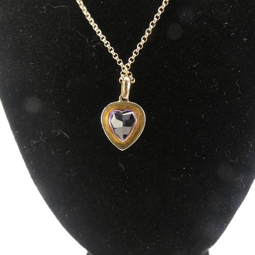 228 - A late Victorian amethyst and seed pearl Pendant, the heart shaped facetted amethyst within a surrou... 