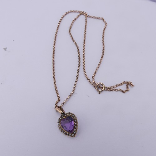 228 - A late Victorian amethyst and seed pearl Pendant, the heart shaped facetted amethyst within a surrou... 