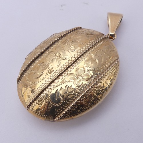 229 - A 9ct yellow gold oval double hinged Locket, in the Victorian style, the front with foliate decorati... 