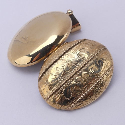 229 - A 9ct yellow gold oval double hinged Locket, in the Victorian style, the front with foliate decorati... 