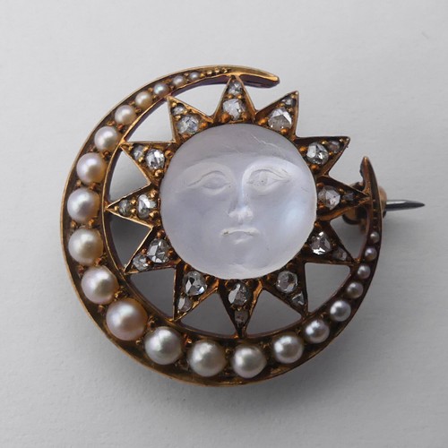 A Victorian 'Man-in-the-Moon' Brooch, the central carved moonstone, 11mm diameter, within a star and crescent moon mount set rose cut diamonds and graduated seed pearls, unmarked, tested as 15ct, with roller catch and metal pin, 24.3mm diameter, total weight 6.6g.