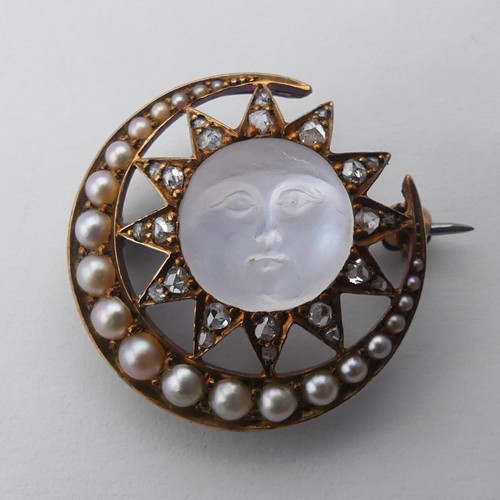 308 - A Victorian 'Man-in-the-Moon' Brooch, the central carved moonstone, 11mm diameter, within a star and... 