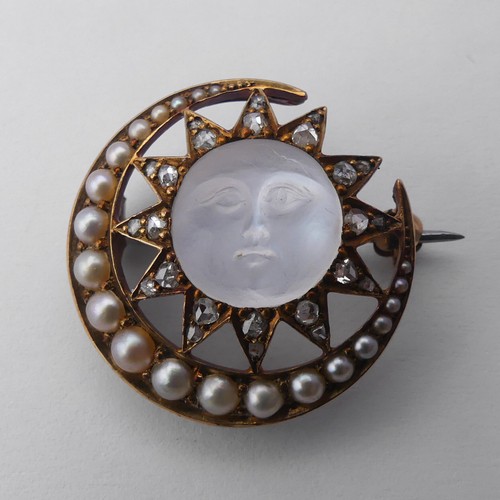 308 - A Victorian 'Man-in-the-Moon' Brooch, the central carved moonstone, 11mm diameter, within a star and... 