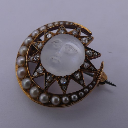 308 - A Victorian 'Man-in-the-Moon' Brooch, the central carved moonstone, 11mm diameter, within a star and... 