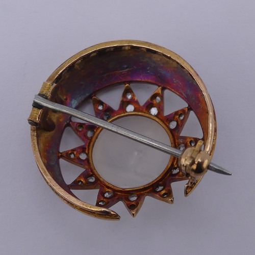 308 - A Victorian 'Man-in-the-Moon' Brooch, the central carved moonstone, 11mm diameter, within a star and... 