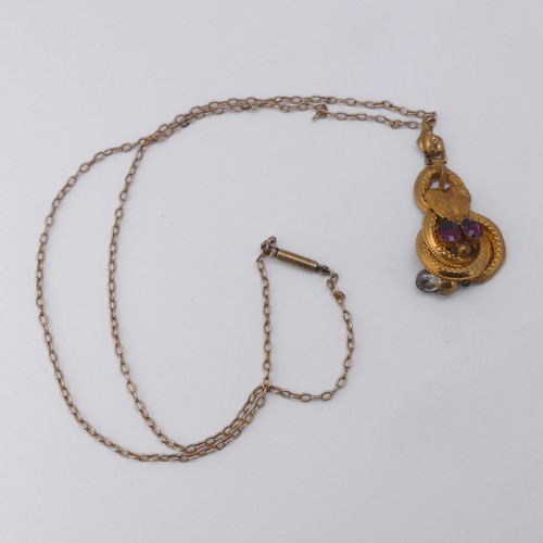 231 - A 19thC gold Pendant, set with two oval facetted garnets and a rock crsytal drop below, unmarked, te... 