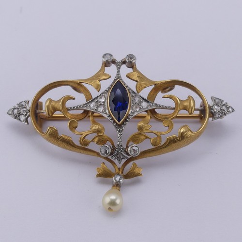 310 - An Art Nouveau sapphire and diamond Brooch, the central marquise sapphire approx. 8.6mm long, in a s... 