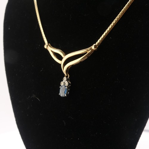 232 - A 9ct gold sapphire and diamond Pendant, the oval facetted sapphire 6.3mm long with three diamond se... 