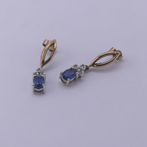 232 - A 9ct gold sapphire and diamond Pendant, the oval facetted sapphire 6.3mm long with three diamond se... 