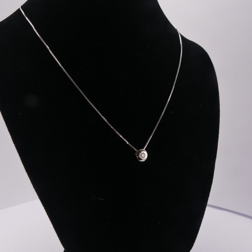 233 - A contemporary 18ct white gold and diamond Pendant and Earring Suite, the brilliant cut stone approx... 