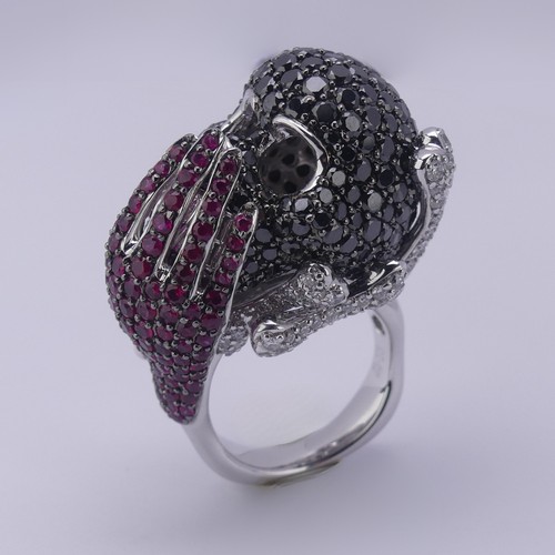 159 - A striking ruby and diamond novelty Dress Ring, in the style of Lydia Courteille, Paris, formed as a... 