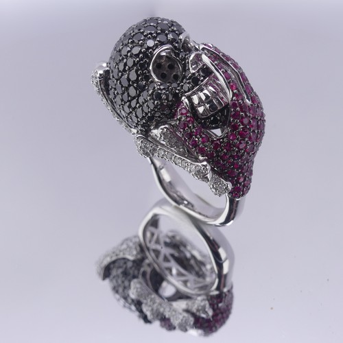 159 - A striking ruby and diamond novelty Dress Ring, in the style of Lydia Courteille, Paris, formed as a... 