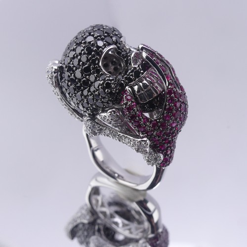 159 - A striking ruby and diamond novelty Dress Ring, in the style of Lydia Courteille, Paris, formed as a... 