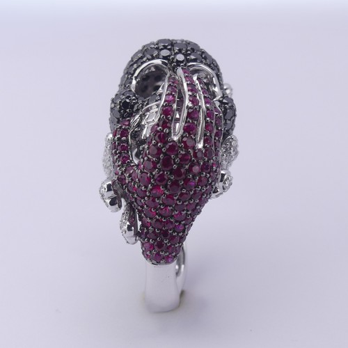 159 - A striking ruby and diamond novelty Dress Ring, in the style of Lydia Courteille, Paris, formed as a... 