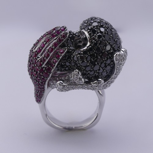 159 - A striking ruby and diamond novelty Dress Ring, in the style of Lydia Courteille, Paris, formed as a... 