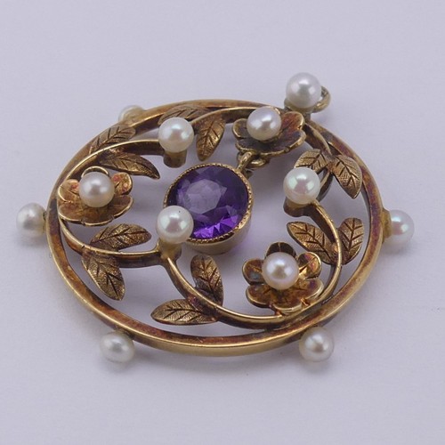 237 - An Edwardian amethyst and seed pearl Pendant, of open circular foliate design with central facetted ... 