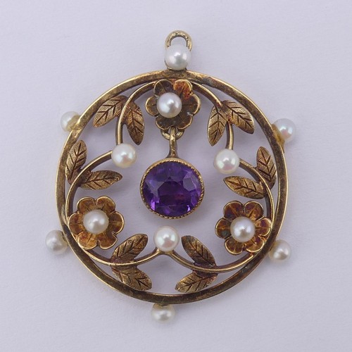 237 - An Edwardian amethyst and seed pearl Pendant, of open circular foliate design with central facetted ... 