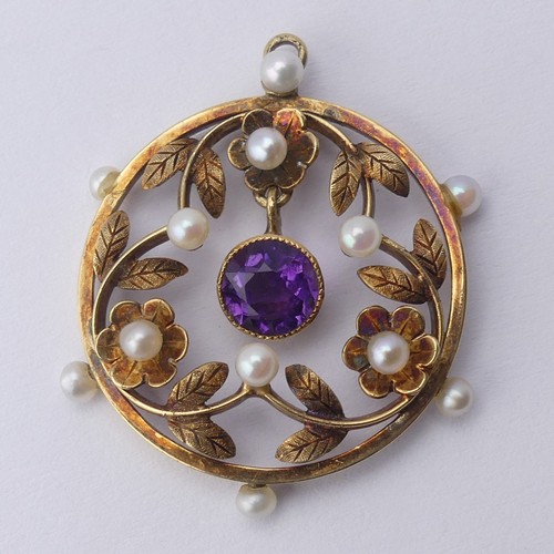 237 - An Edwardian amethyst and seed pearl Pendant, of open circular foliate design with central facetted ... 