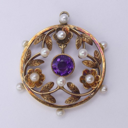 237 - An Edwardian amethyst and seed pearl Pendant, of open circular foliate design with central facetted ... 