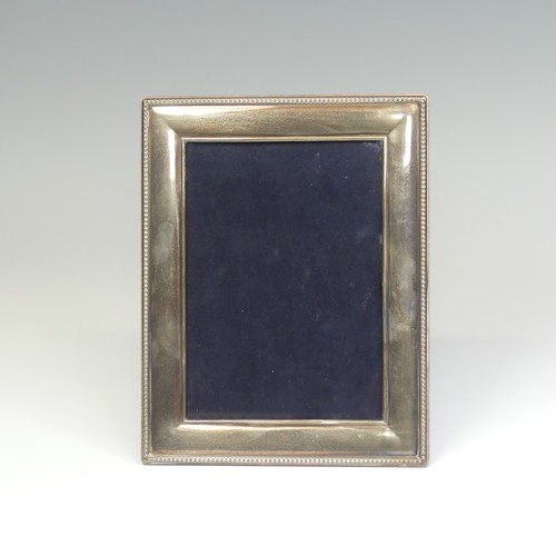 65 - An Elizabeth II silver mounted Easel Frame, hallmarked Sheffield, 2003, with beaded rim, apertu... 