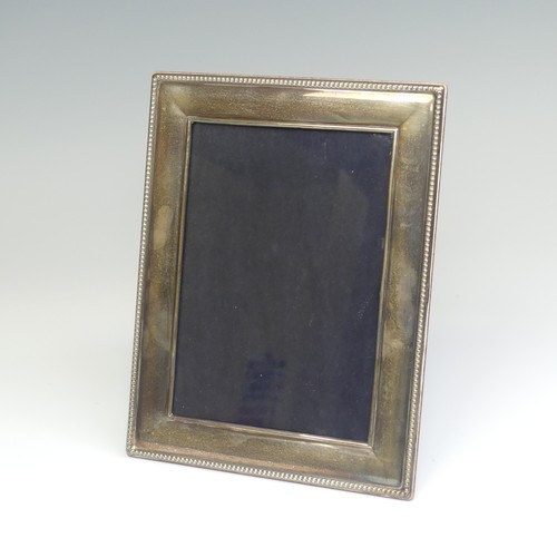 65 - An Elizabeth II silver mounted Easel Frame, hallmarked Sheffield, 2003, with beaded rim, apertu... 