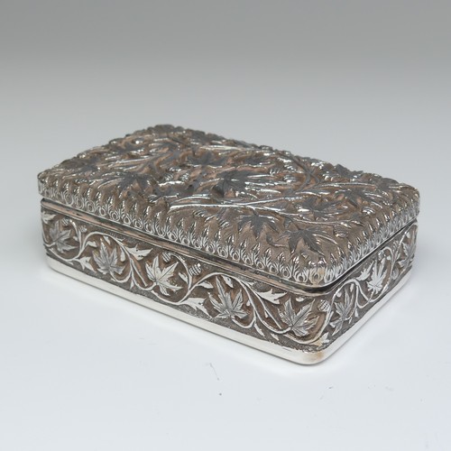 40 - An Indian silver Cigarette Box, of hinged rectangular form with all over foliate decoration, cedar l... 