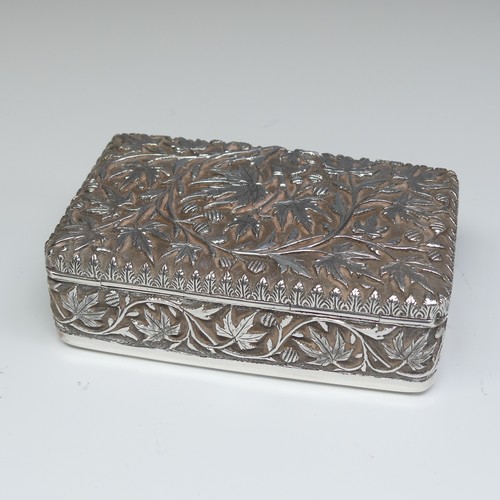 40 - An Indian silver Cigarette Box, of hinged rectangular form with all over foliate decoration, cedar l... 