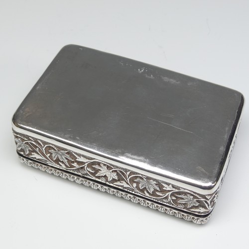 40 - An Indian silver Cigarette Box, of hinged rectangular form with all over foliate decoration, cedar l... 