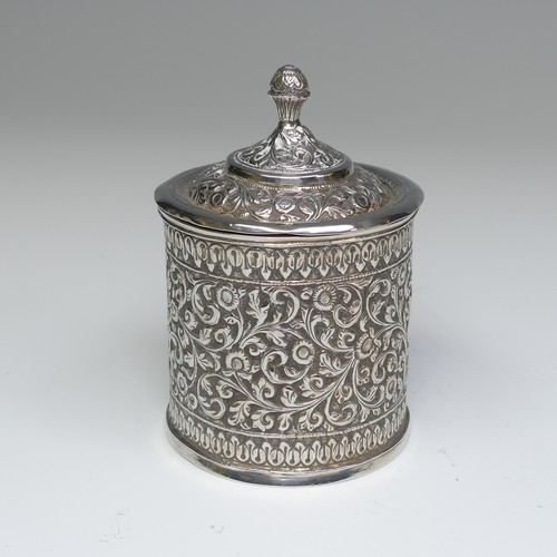 41 - An Indian circular silver Pot and Cover, with all over scrolling foliate decoration, the removable c... 