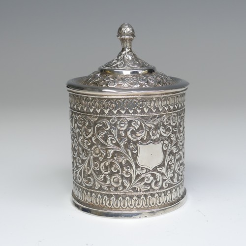 41 - An Indian circular silver Pot and Cover, with all over scrolling foliate decoration, the removable c... 