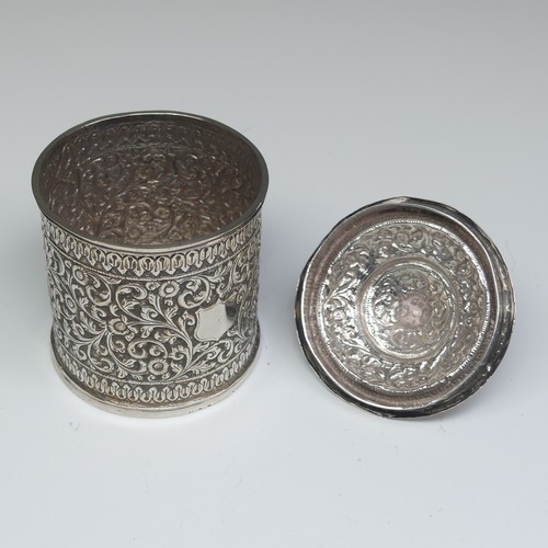 41 - An Indian circular silver Pot and Cover, with all over scrolling foliate decoration, the removable c... 