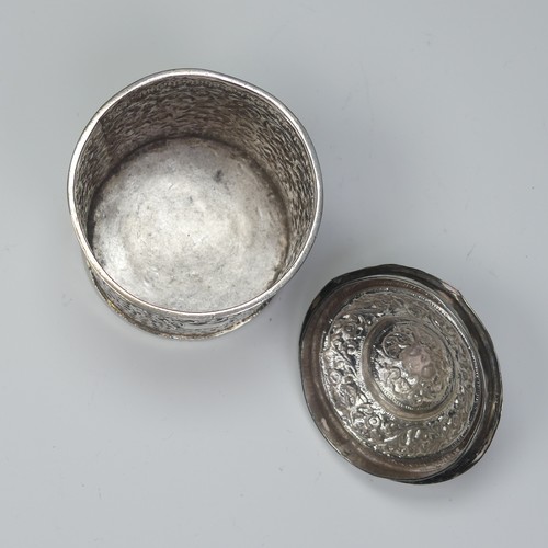 41 - An Indian circular silver Pot and Cover, with all over scrolling foliate decoration, the removable c... 