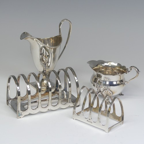 43 - A George V silver five bar Toast Rack, by Viner’s, hallmarked London, 1935, 7.5cm long, togeth... 