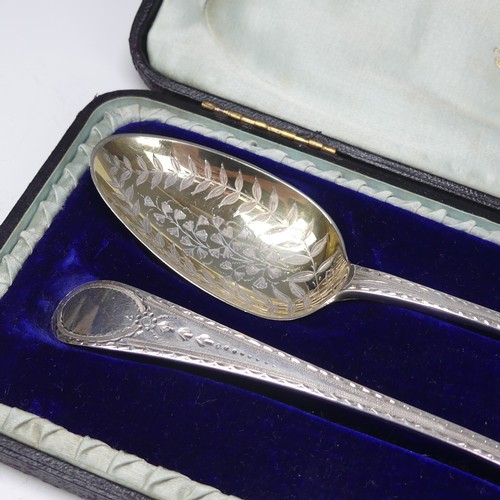 18 - A cased matched pair of George III silver Serving Spoons, one John Lambe, London 1788, the other Geo... 