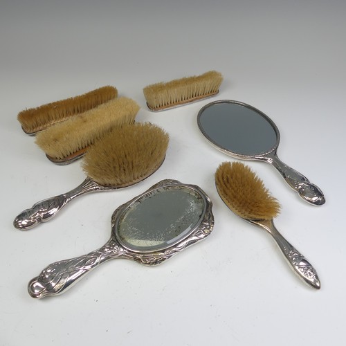 53 - An Edwardian silver backed Hand Mirror, by Walker & Hall, hallmarked Sheffield, 1905, with styli... 