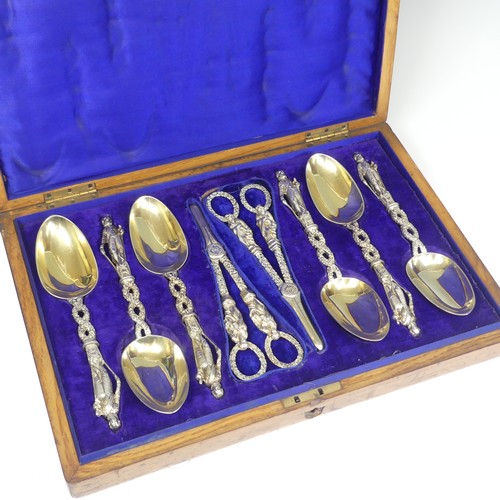 57 - A matched set of six silver gilt Serving Spoons with a pair of Grape Scissors, the spoons by He... 