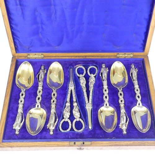 57 - A matched set of six silver gilt Serving Spoons with a pair of Grape Scissors, the spoons by He... 