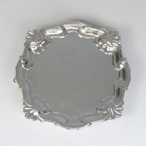 28 - A George II silver Waiter, by Hugh Mills, hallmarked London 1747, of shaped square form with shell c... 