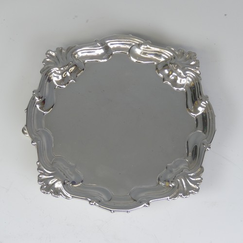 28 - A George II silver Waiter, by Hugh Mills, hallmarked London 1747, of shaped square form with shell c... 