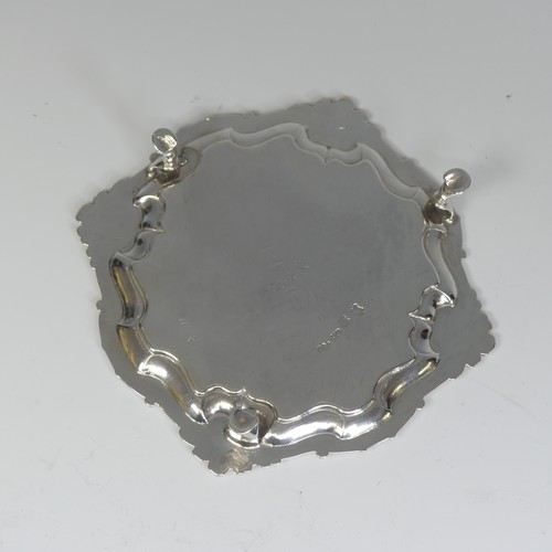 28 - A George II silver Waiter, by Hugh Mills, hallmarked London 1747, of shaped square form with shell c... 