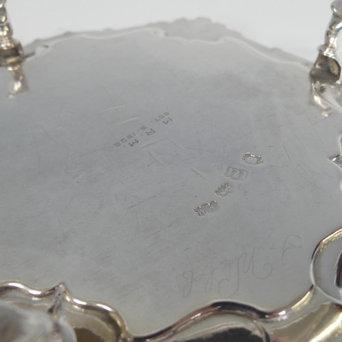 28 - A George II silver Waiter, by Hugh Mills, hallmarked London 1747, of shaped square form with shell c... 