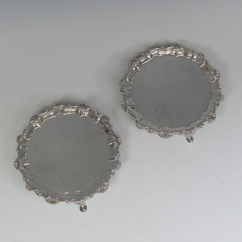 26 - A pair of George III silver Waiters, by Ebenezer Coker, hallmarked London 1772, of circular form wit... 