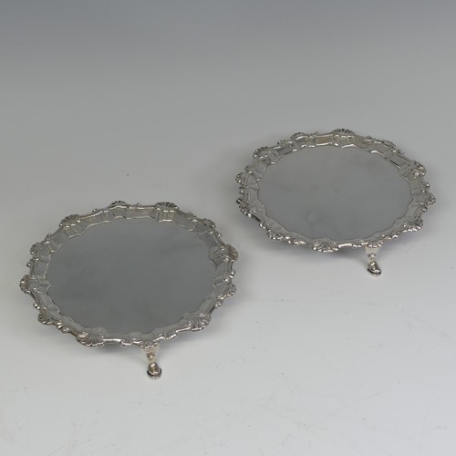 26 - A pair of George III silver Waiters, by Ebenezer Coker, hallmarked London 1772, of circular form wit... 