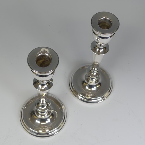 29 - A pair of Elizabeth II silver Candlesticks, by A T Cannon Ltd., hallmarked Birmingham, 1973, with we... 