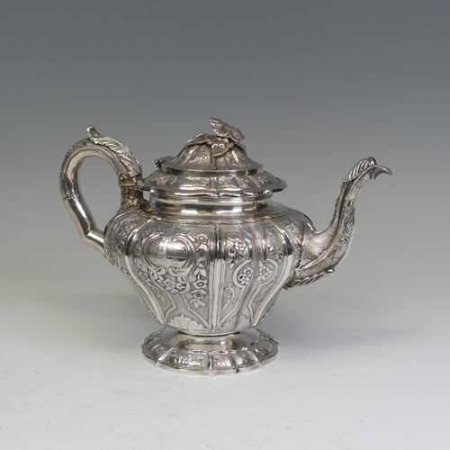 31 - An early Victorian silver melon shaped Teapot, by J E Terrey & Co., hallmarked London 1843, with... 