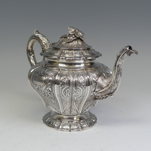 31 - An early Victorian silver melon shaped Teapot, by J E Terrey & Co., hallmarked London 1843, with... 